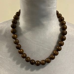 Brown beaded necklace. Wooden beads. Worn several times. Listing #7255